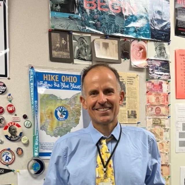 Harvey Lewis standing in his classroom