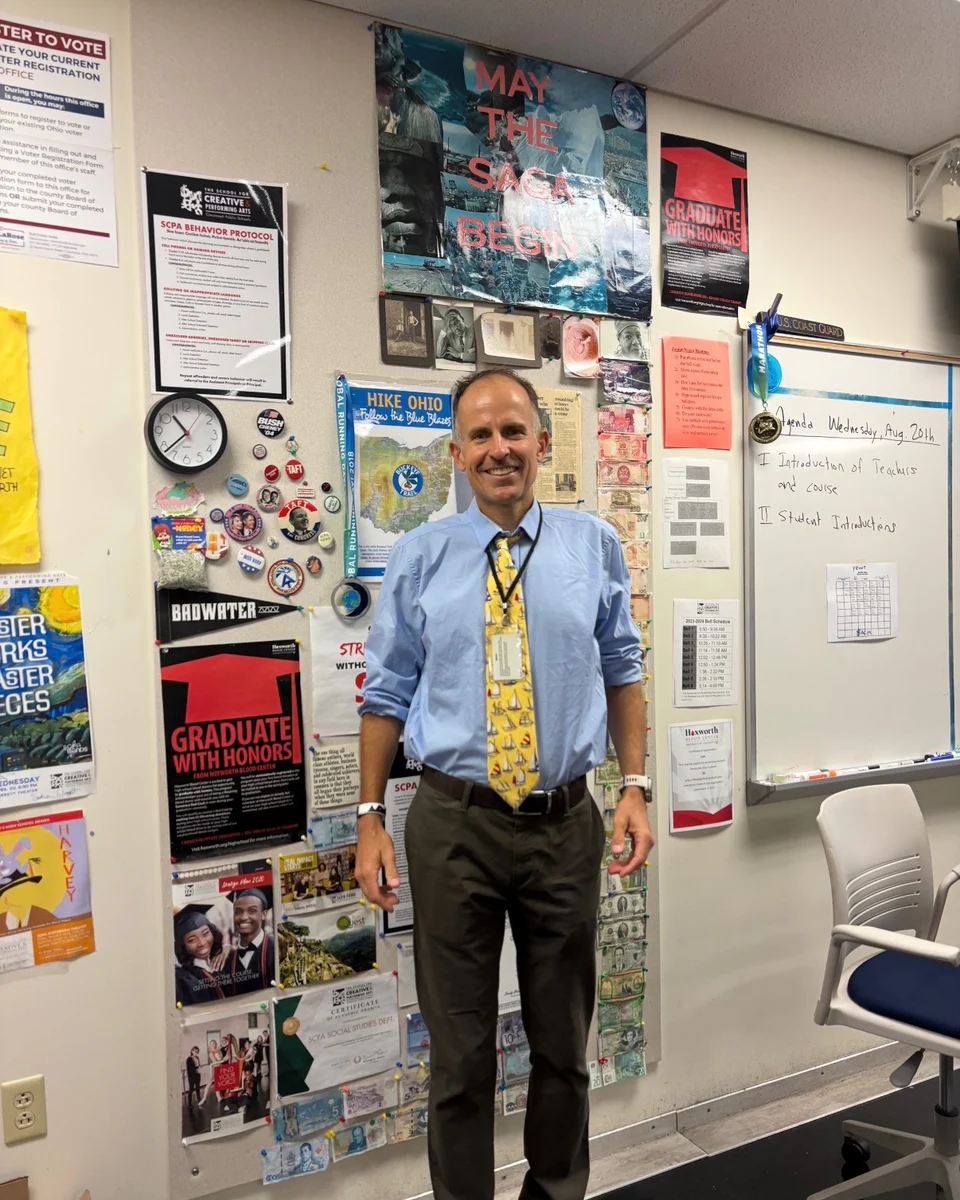 Harvey Lewis standing in his classroom